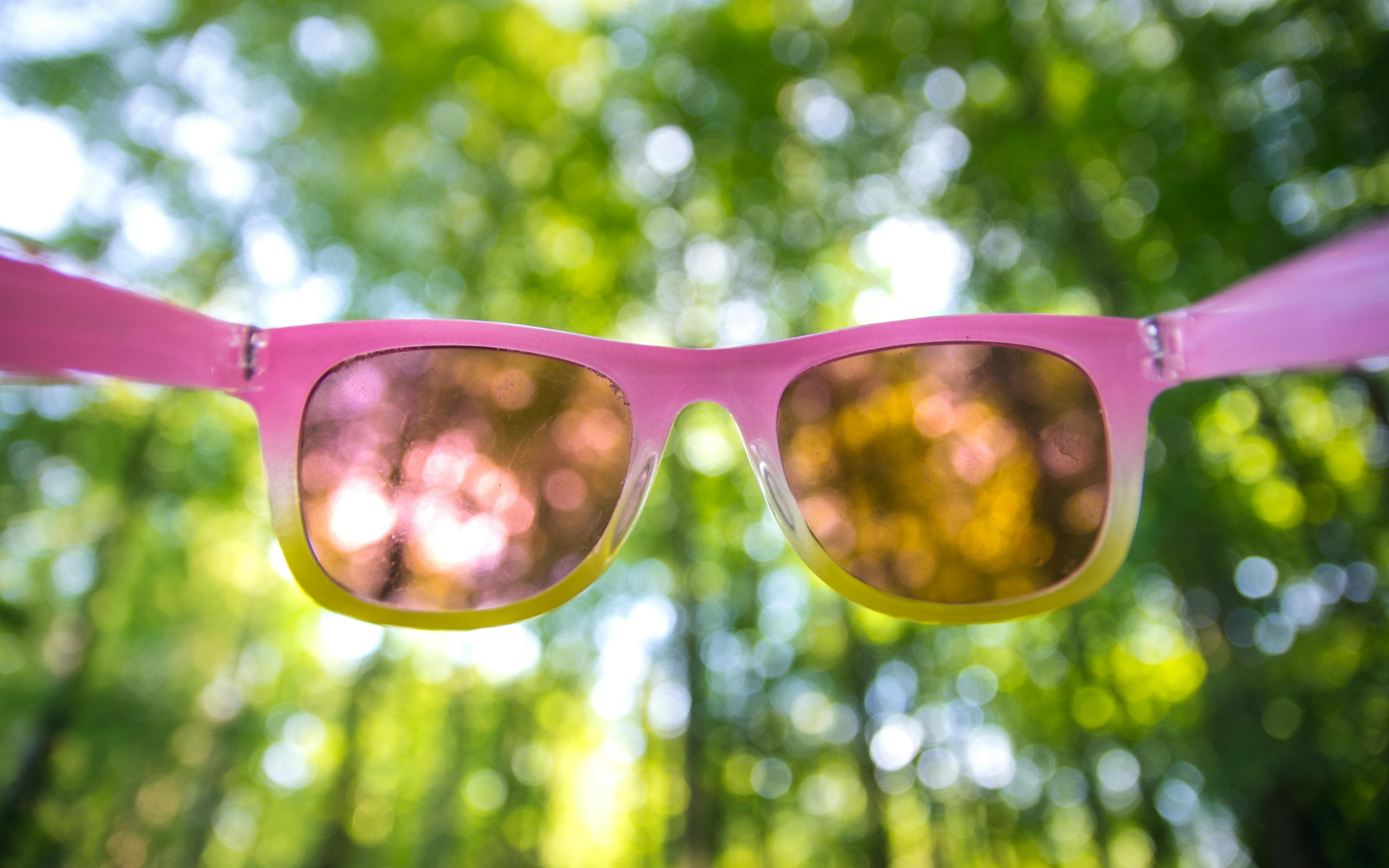 Sunglasses on a bright sunny surface, close-up lens detail