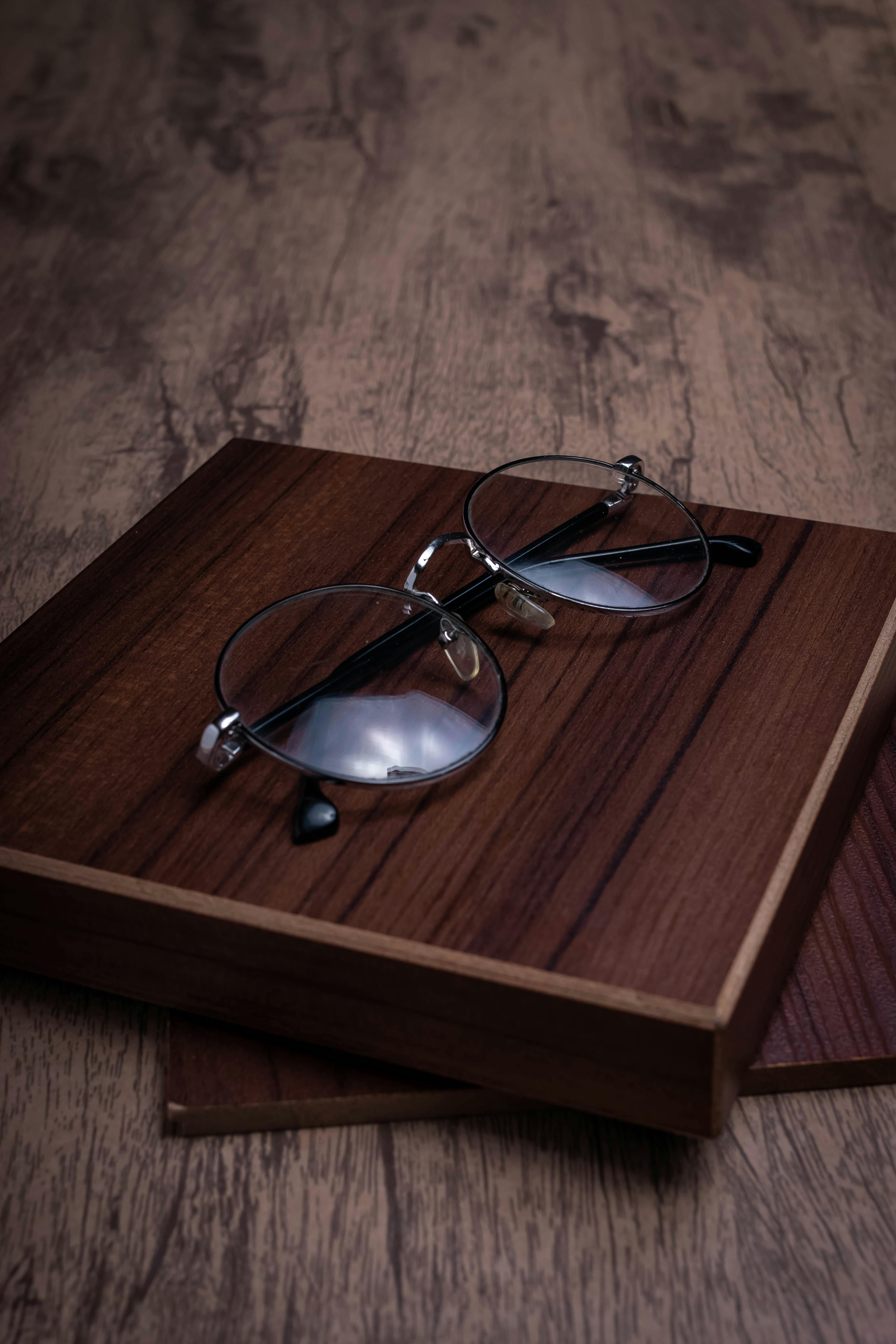 Thin wire frame sunglasses on a neutral surface